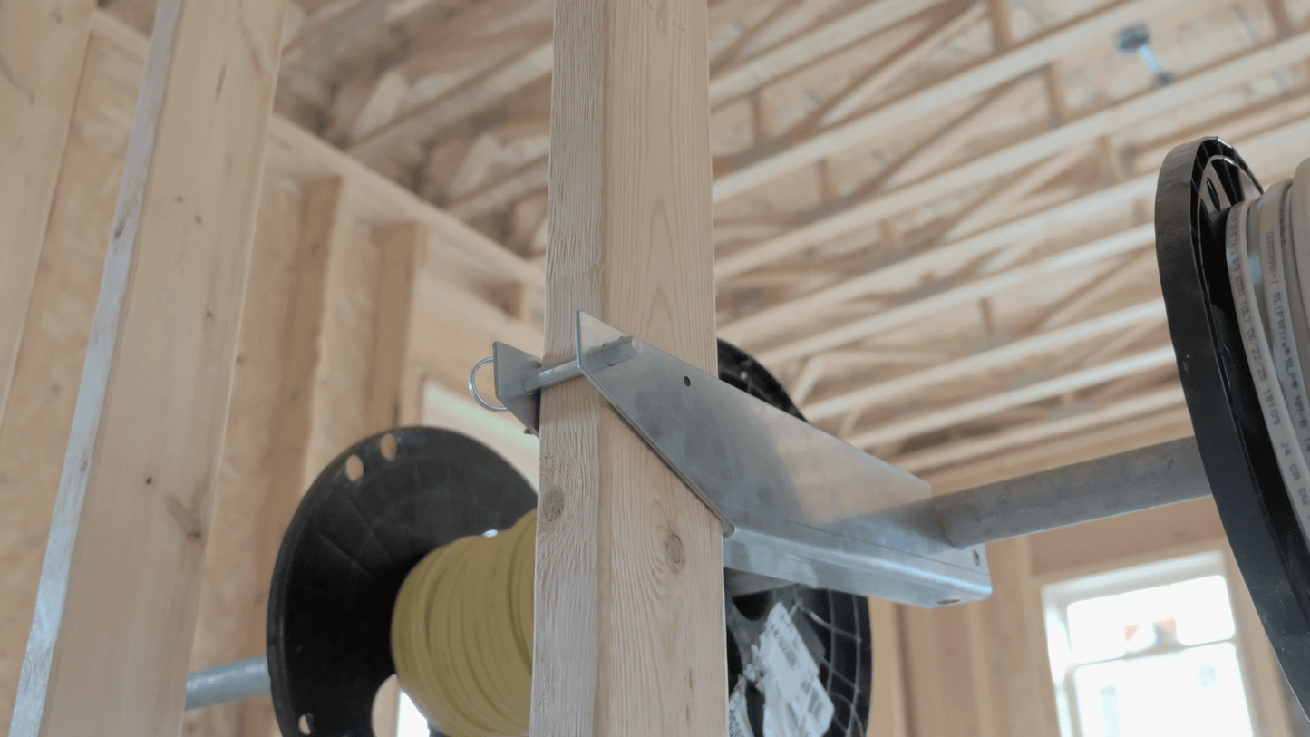 Metal bracket attached to wooden beams in a construction setting
